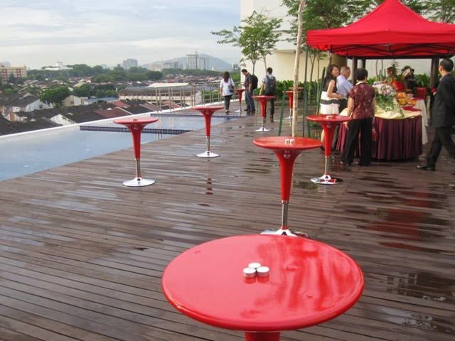 tall red tables, after rain