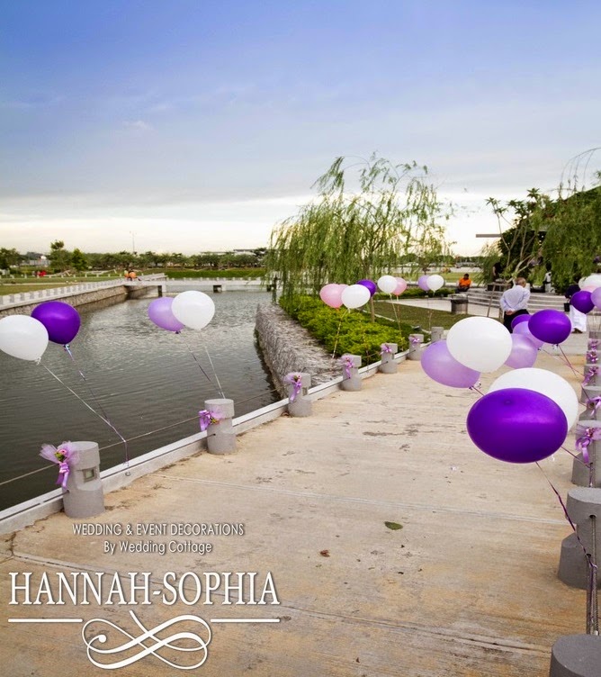 purple white balloons tied to the side pillar